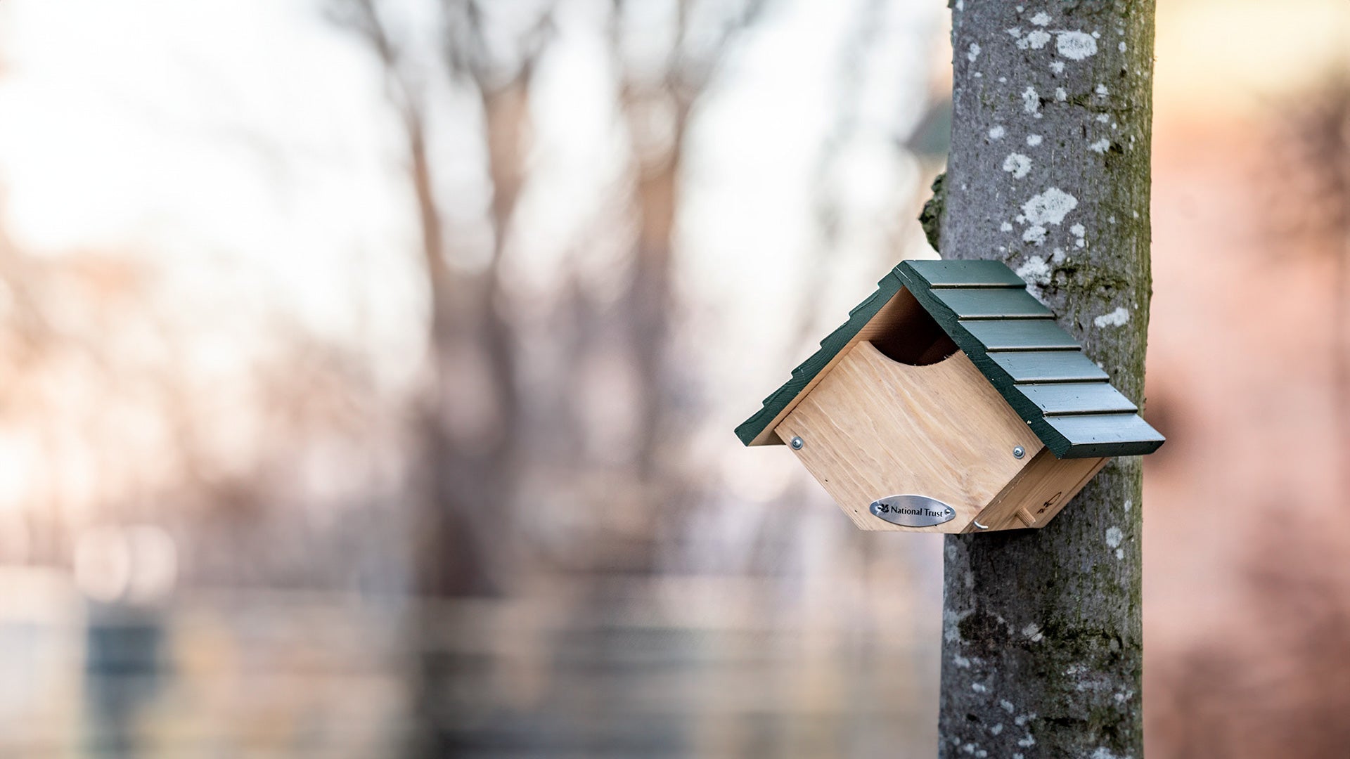 Light wooden nest box on a brick wall