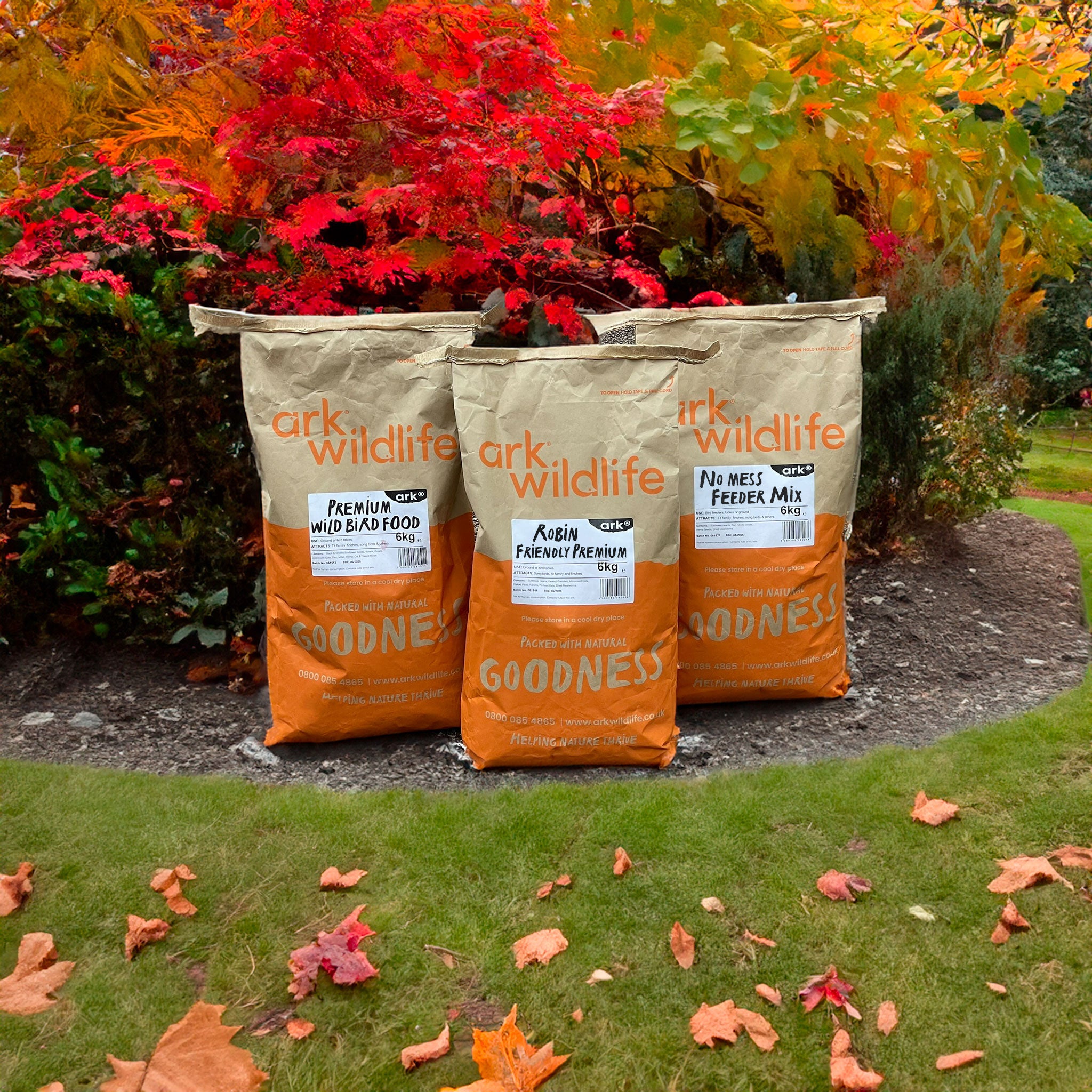 Bags of Ark Wildlife bird seed in autumn garden